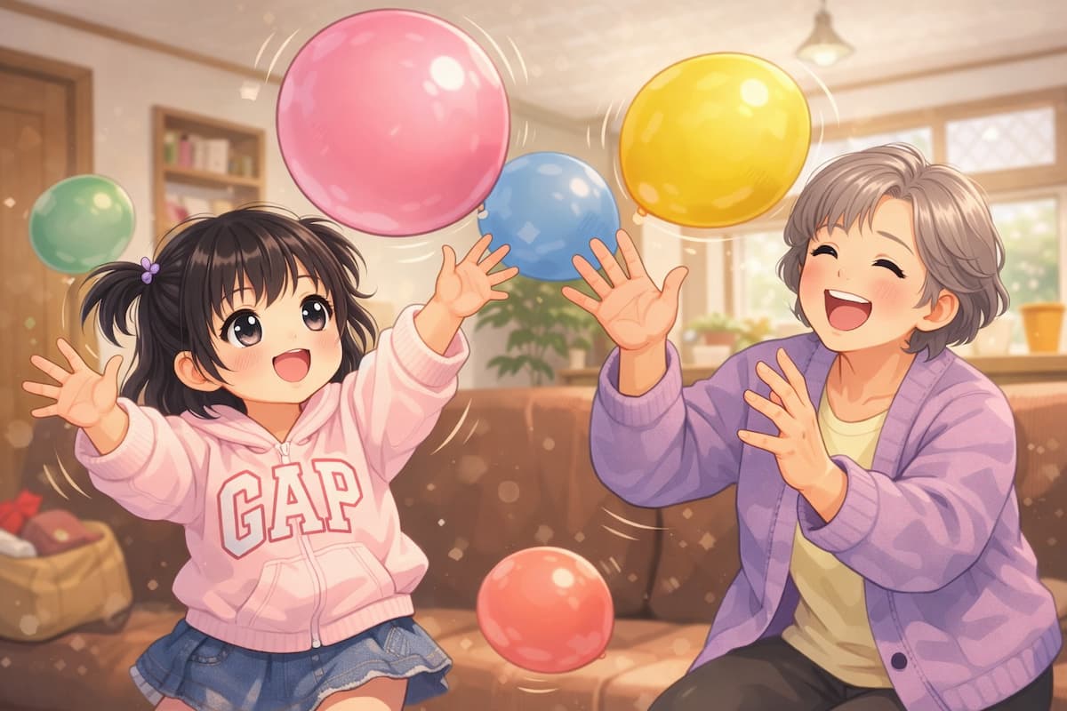 孫と風船遊びをする祖母