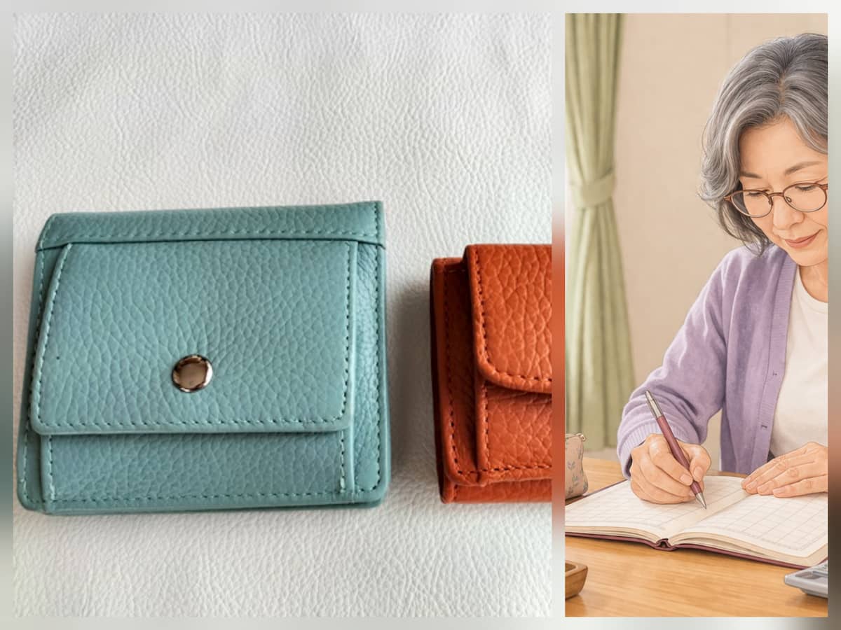 財布と家計簿を記入 している60代女性